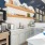 Coffee machine next to kitchen with open shelving