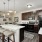 Kitchen with brown cabinets and black electric appliances