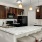 a kitchen with a bar stool and a bar stool